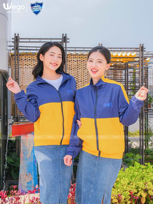 Đồng phục áo gió Nano Protect màu vàng phối xanh đen